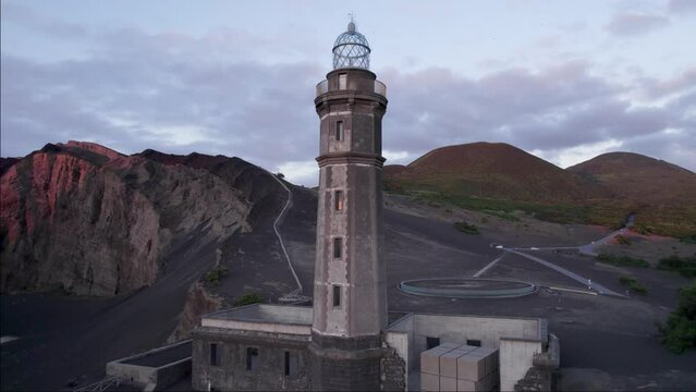 Aerial arc around historic Lighthouse of Capelinhos on island of Faial, Azores