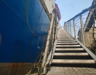 Stairway to heaven, Steep ladders, vessel gangway with nets on either side connect the ship and the...