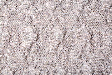 Knitted texture. Pattern fabric made of wool. Background, copy space. Handmade sweater texture, knitted wool pattern