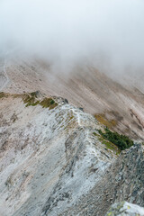 Mountain hiking trail in the clouds