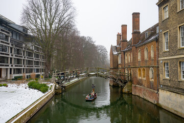 Mathematical Bridge , wooden footbridge over River Cam around University of Cambridge during winter snow at Cambridge , United Kingdom : 3 March 2018