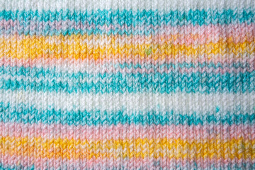 Knitted texture. Pattern fabric made of wool. Background, copy space. Handmade sweater texture, knitted wool pattern