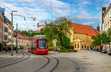 Bratislava, Slovakia. Modern red tram in front of the Bratislava castle