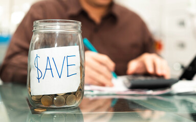 businessman accounting coins in save symbol label jar for finance save salary economic account concept