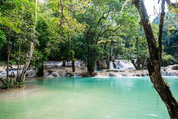 ad Sae Waterfall,Luang Prabang,Laos.Waterfall forest with rock and turquoise blue pond.