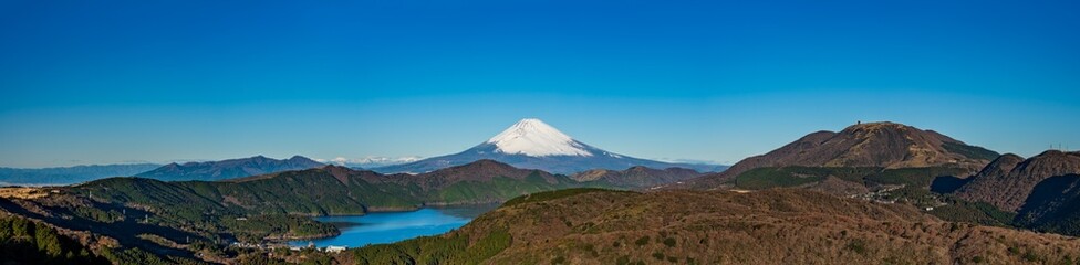 Banner image of Mt. Fuji and Ashinoko lake with blue sky background at daytime. - obrazy, fototapety, plakaty