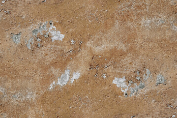 Brown grunge textured rugged wall surface for background