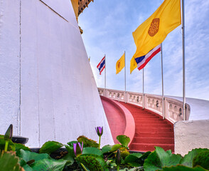Thai national, buddhism and Thai Royal flags at red staircase and