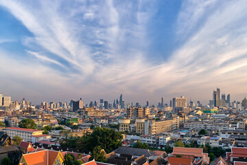 Naklejka premium Cityscape of Bangkok city center in sunset, blue sky and clouds