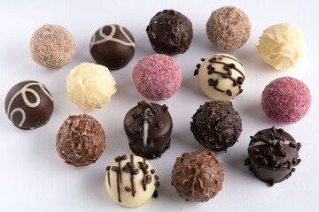 photo different chocolate round sweets
