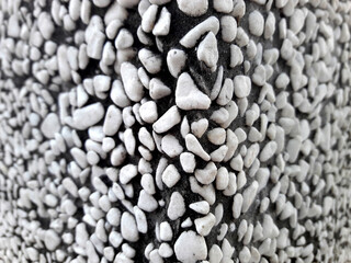 White decorative gravel background. Garden pond gravel background. Seamless texture of white stone or gravel. Adhesive decoration on the wall or floor. Enhanced protection. (selective focus)