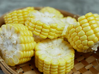 chopped raw corn on a bamboo plate