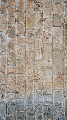 Stone Wall Weathered Obsolete Texture. Aged Brickwork. Distressed grunge Surface. Background Backdrop Banner. Vertical Photo