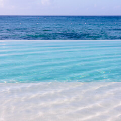 Fototapeta na wymiar Infinity pool facing the Caribbean Sea, Punta Cana, Dominican Republic