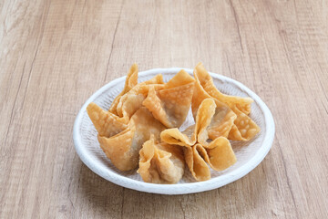 Pangsit Goreng (Chicken Fried Dumpling), Indonesian Traditional Food. Served with sauce
