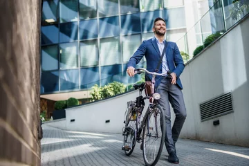 Fotobehang Happy middle age caucasian stylish businessman going to work by bike. © DusanJelicic