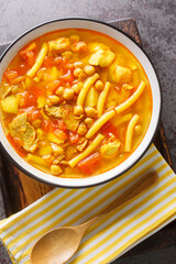 Rancho Canario stew Canary Islands traditional Food closeup on the board on the table. Vertical top view from above