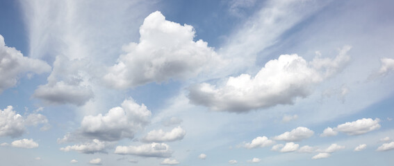 Panoramic photo of blurred sky. Blue sky background with cumulus clouds