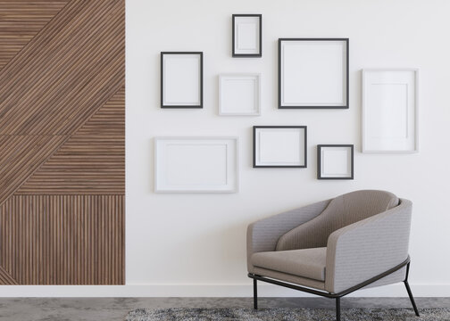 Various empty picture frames on white wall in modern room. Mock up interior in contemporary style. Free, copy space for pictures, posters, artworks or photos. Group of frames. 3D render.