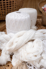 Close focus on white cotton yarn prepared for sewing.