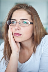 portrait of a teenager brunette girl with eyeglasses