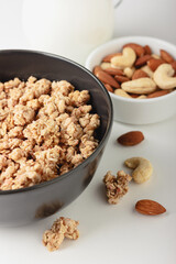 Granola in bowl on light background.