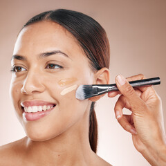 Beauty, makeup and woman with foundation in a studio for cosmetic skincare routine with a brush....