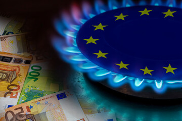 europe flag and hob burner of blue gas with euro cash banknotes on background, cost of gas, the...