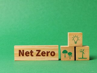 Wooden blocks written net zero with icons. Net zero action concept. 