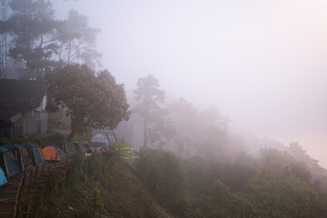 Tent on the background of the misty mountains