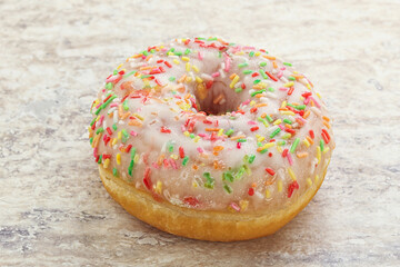 Sweet glazed vanilla donut with icing