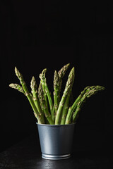Green asparagus with copy space on a black background