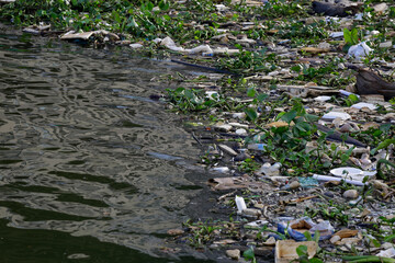 Aerial view of trash polluting the Saigon river, downtown Ho Chi Minh City, Vietnam.