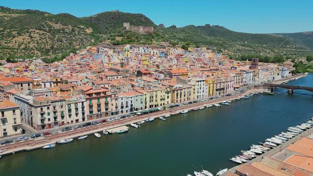 Bosa Colorful Town and Temo River  in Sardinia, Italy - 4k Aerial Circling
