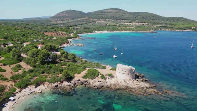 Small cove in front of Cala Spinosa Beach at Capo Testa, Santa Teresa di Gallura, Sardinia, Italy - 4k Aerial