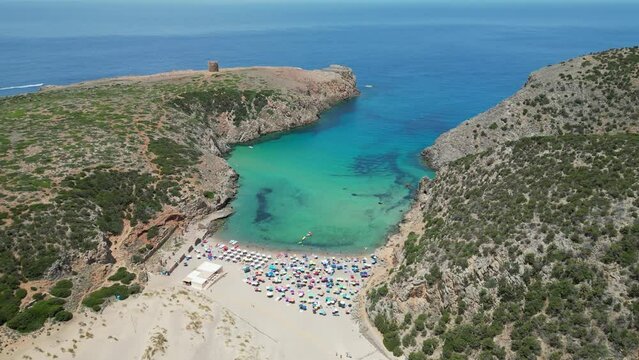 Cala Domestica Sandy Beach and Blue Cove in Sardinia, Italy - 4k Aerial