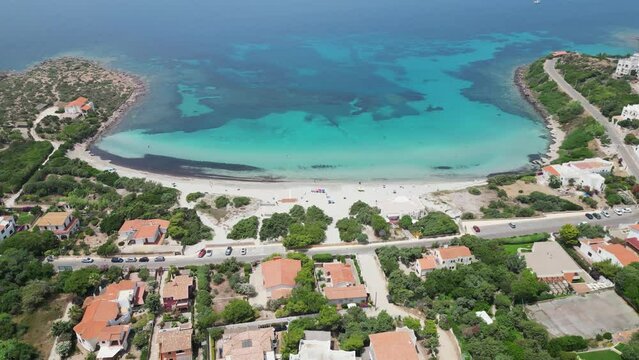 Sotto Torre Beach at Calasetta Coastal Village, Sardinia, Italy - 4k Aerial Panning Down
