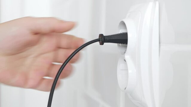 Plug in Electrical Cord in Socket, Plugging Devices, Electric Power View, Save Cost in Energy Industry Crisis