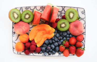 Fresh organic summer colorful fruit - healthy food in white background, healthy eating concept - copy space