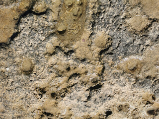 Coast of the Mediterranean Sea, long frozen lava. Background. It looks like an alien landscape.