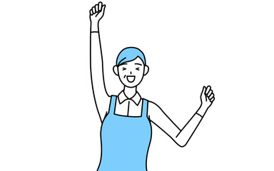 笑顔でジャンプするエプロンを着たシニア女性