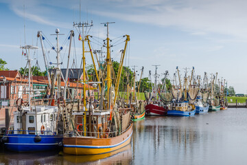 Fishing harbor with trawlers, Greetsiel, Lower Saxony, Germany
