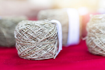 Fototapeta na wymiar Closeup Hemp thread roll, organic and eco product for craft and cloth making, product of Thailand