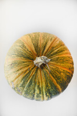 Yellow-green pumpkin on the windowsill. A large pumpkin on a white background.