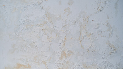 Rain water leaks on the wall causing damage and peeling paint