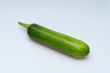 Fresh green(young)pumpkin on a white background