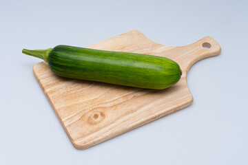 Fresh green(young)pumpkin on a white background