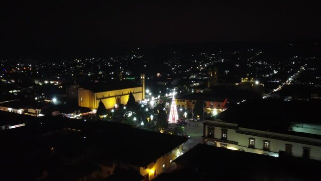 Aerial shot of Christmas decoration in the small village of the Mexico. Night view of the village. 