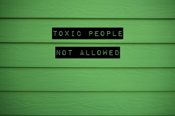 Green background with text TOXIC PEOPLE NOT ALLOWED, concept of avoiding negative vibes people who behave toxically to upset or impact others , should cut them out from life before getting drained - obrazy, fototapety, plakaty