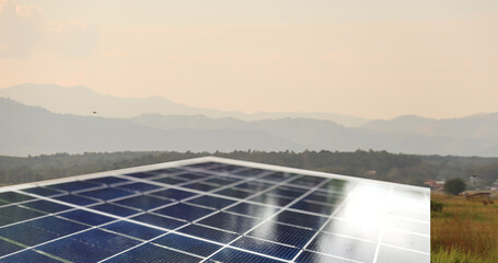 Photovoltaic panel which is dirty and foggy with blur gray sky in background edited with the sun light